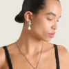 Boucles d&rsquo;oreilles asymétriques en métal, cristaux et perles