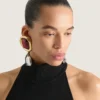 Boucles d&rsquo;oreilles clip sculpturales en métal et cristaux