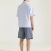 Chemise rayée en coton avec imprimé surréaliste Chemise rayée en coton avec imprimé surréaliste