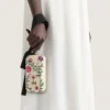 Pochette de soirée avec broderies florales et nœud Pochette de soirée avec broderies florales et nœud