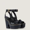 Sandales à plateforme de style sabots en cuir avec clous