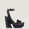 Sandales à plateforme de style sabots en cuir avec clous