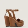 Sandales à plateforme de style sabots en cuir avec clous