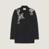 Veste à double boutonnage fendue en laine avec paillettes Veste à double boutonnage fendue en laine avec paillettes